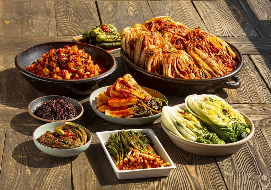 Traditional Korean Kimchi in a ceramic bowl, illustrating the fermentation process and "Yak-sik-dong-won" philosophy.