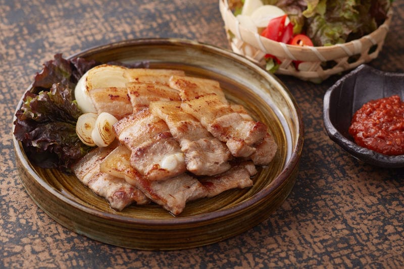 Korean culture - Samgyeopsal (grilled pork belly) in Korean food in movies representing social connection and isolation.